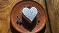Homemade lavender ice cream in in the shape of a heart in rural clay plate decoration blueberry. Creamy vegan lavender ice cream