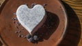 Homemade lavender ice cream in in the shape of a heart in rural clay plate decoration blueberry. Creamy vegan lavender ice cream