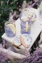 Homemade lavender lemonade with fresh lemons on a white wooden tray Royalty Free Stock Photo