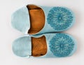 Homemade leather slippers on white background. Pair of blue slipper handmade Royalty Free Stock Photo