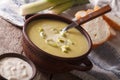 Homemade leek soup in a bowl close-up on the table. Horizontal Royalty Free Stock Photo