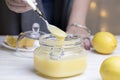 Homemade lemon curd. Lemon curd in a glass jar Royalty Free Stock Photo