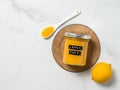 Homemade lemon curd in jar, top view, vertical Royalty Free Stock Photo