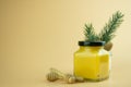 Homemade lemon curd in small glass jar with black lid on yellow background Royalty Free Stock Photo