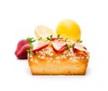 Homemade lemon loaf with strawberry slices isolated on white Royalty Free Stock Photo