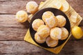 Homemade lemon muffins sprinkled with zest close-up on a plate. Royalty Free Stock Photo