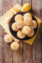 Homemade lemon muffins sprinkled with zest close-up on a plate. Royalty Free Stock Photo