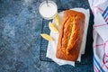 Homemade lemon poppy seed pound cake on a wire rack. Blue stone Royalty Free Stock Photo