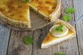 Homemade lemon tart. Sweet citrus dessert with mint leaves anc jelly cream. Rustic wooden background. Royalty Free Stock Photo