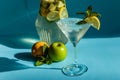 Homemade lemonade with lemon, mint and apple on a blue background Royalty Free Stock Photo