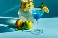 Homemade lemonade with lemon, mint and apple on a blue background Royalty Free Stock Photo