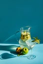 Homemade lemonade with lemon, mint and apple on a blue background Royalty Free Stock Photo