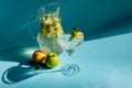 Homemade lemonade with lemon, mint and apple on a blue background Royalty Free Stock Photo