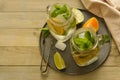 Homemade lemonade with lime, mint in a mason jar on a wooden rustic table. Summer drinks. Copy space Royalty Free Stock Photo