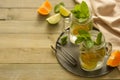 Homemade lemonade with lime, mint in a mason jar on a wooden rustic table. Summer drinks. Copy space Royalty Free Stock Photo