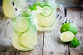 Homemade lemonade with lime, mint in a mason jar on a wooden table Royalty Free Stock Photo