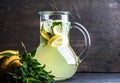 Homemade lemonade with mint, lemon slices and ice over dark background, copy space Royalty Free Stock Photo