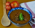 Tasty Homemade Lentil soup with Pork Sausages called Chorizo, Blood sausage called Morcilla and green pepper in a bowl decorated Royalty Free Stock Photo