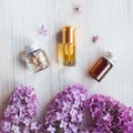 Homemade lilac cosmetics, care products, Small jars with infusion water of lilac, essential oil,