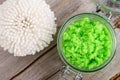 Homemade lime fruit scrub bath salt, foot soak, facial or hair mask in a glass jar and bath sponge. Natural beauty treatment,