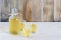 Homemade limonchello on the wooden background Royalty Free Stock Photo