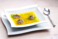 homemade liver dumplings in chicken soup with carrots and peas Royalty Free Stock Photo