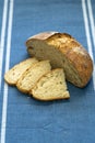 Homemade loaf and slices of freshly baked artisan sourdough bread Royalty Free Stock Photo