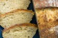 Homemade loaf and slices of freshly baked artisan sourdough bread Royalty Free Stock Photo