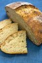 Homemade loaf and slices of freshly baked artisan sourdough bread Royalty Free Stock Photo