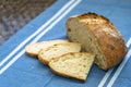 Homemade loaf and slices of freshly baked artisan sourdough bread Royalty Free Stock Photo