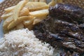 Homemade Lunch served with steak french fries and white rice