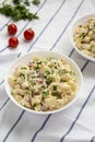 Homemade Macaroni Salad in white bowls, side view Royalty Free Stock Photo