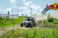 Homemade machine built with tuning rally buggy rides with the driver and co-driver at high speed past the spectators along the du