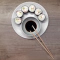 Homemade maki sushi rolls with crab sticks, soy sauce and sticks. Japanese food Royalty Free Stock Photo