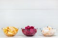 Homemade marinated cabbage kimchi, sauerkraut and beet sauerkraut sour in glass bowls on white wooden background. Royalty Free Stock Photo