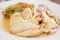 Homemade marinated chicken with white wine serve on white dish,