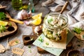 Homemade marinated diced cheese feta in glass jar with herbs, garlic, basil Royalty Free Stock Photo