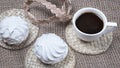 Homemade marshmallows and coffee cup. Banner with meringue cookies on natural sackcloth  background Royalty Free Stock Photo