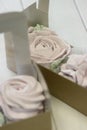 Homemade marshmallows. Zephyr flowers in a paper gift box. Close-up Royalty Free Stock Photo