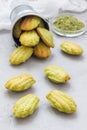 Homemade matcha green tea madeleines on the table and in metal bucket