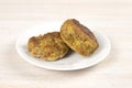 Homemade meat burger patties cutlet on white plate on table background. Ketogenic, carnivore