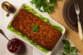 Homemade meat pie with vegetables, served with cranberry sauce Royalty Free Stock Photo