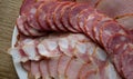 Homemade Meat Processing. Sliced Pork Sausage, Ham And Smoked Ribs Laid Out On A Plate At Cutting Board Detailed Stock Photo Royalty Free Stock Photo