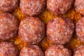 Homemade meatballs with tomato sauce, carrot and spices. Raw ground beef meatballs with rice in a white dish for baking. White Royalty Free Stock Photo