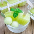 Homemade melon popsicles in the glass, closeup, square