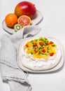 Homemade meringue pie decorated with fresh fruit. Royalty Free Stock Photo