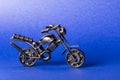 Toy model of a sports motorcycle on a blue background Royalty Free Stock Photo