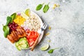 Homemade Mexican chicken burrito bowl with rice, beans, corn, tomato, avocado, spinach. Taco salad lunch bowl. Royalty Free Stock Photo