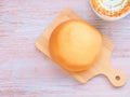 Homemade mexican vanilla bun (coffee bun) on wooden plate and coffee cup over rustic table. Royalty Free Stock Photo