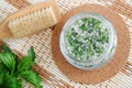 Homemade mint exfoliating scrub foot soak, bath salt with sugar, chopped mint leaves, olive oil end essential mint oil.